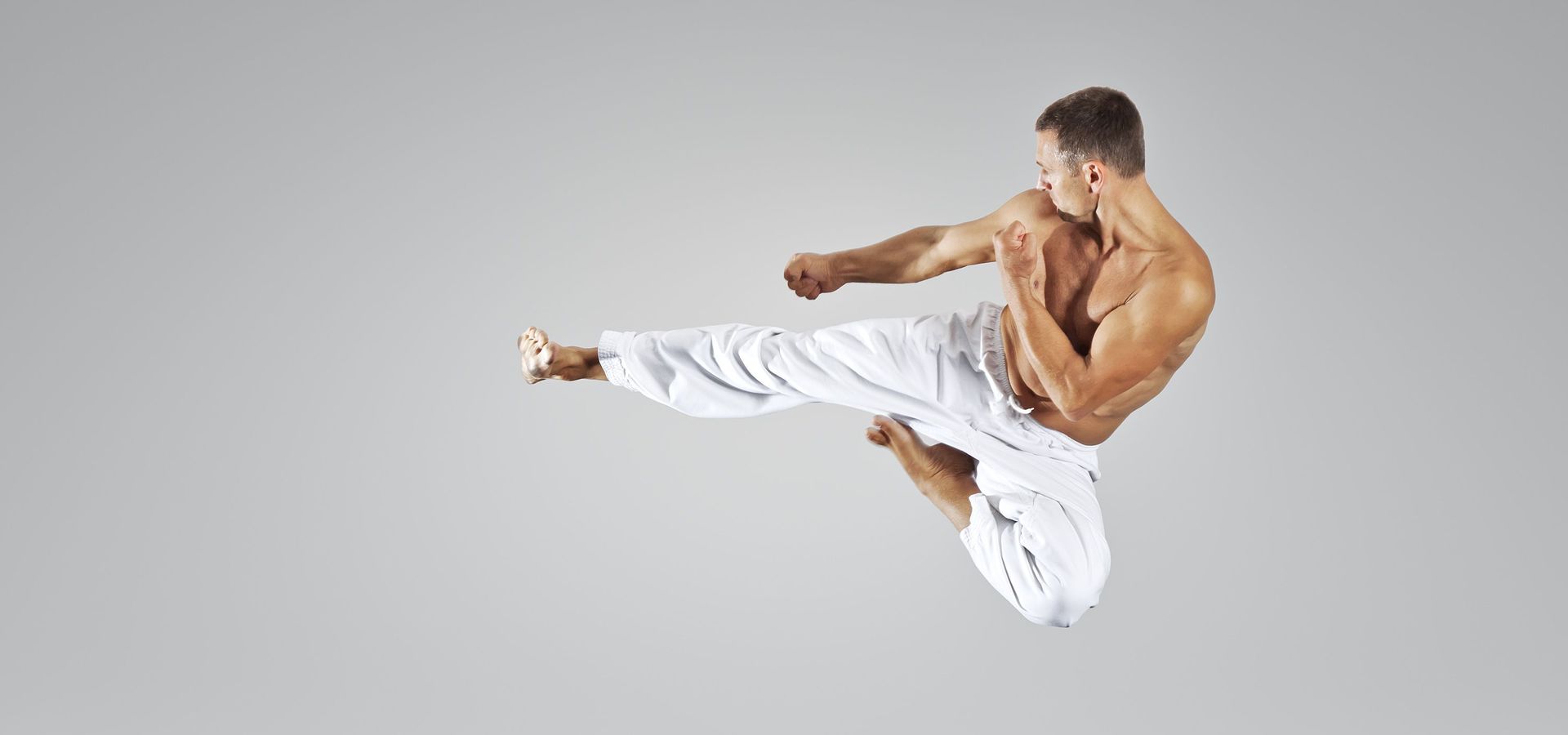 Karate jump kick in the air