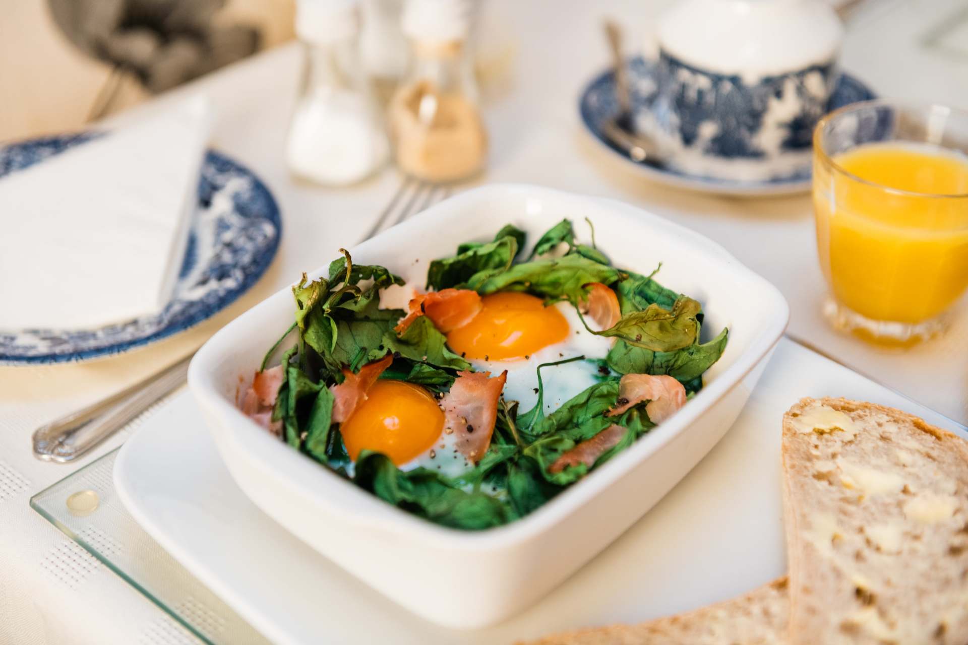 modern, clean dining room featuring locally sourced breakfast - this is our Baked Eggs Special
