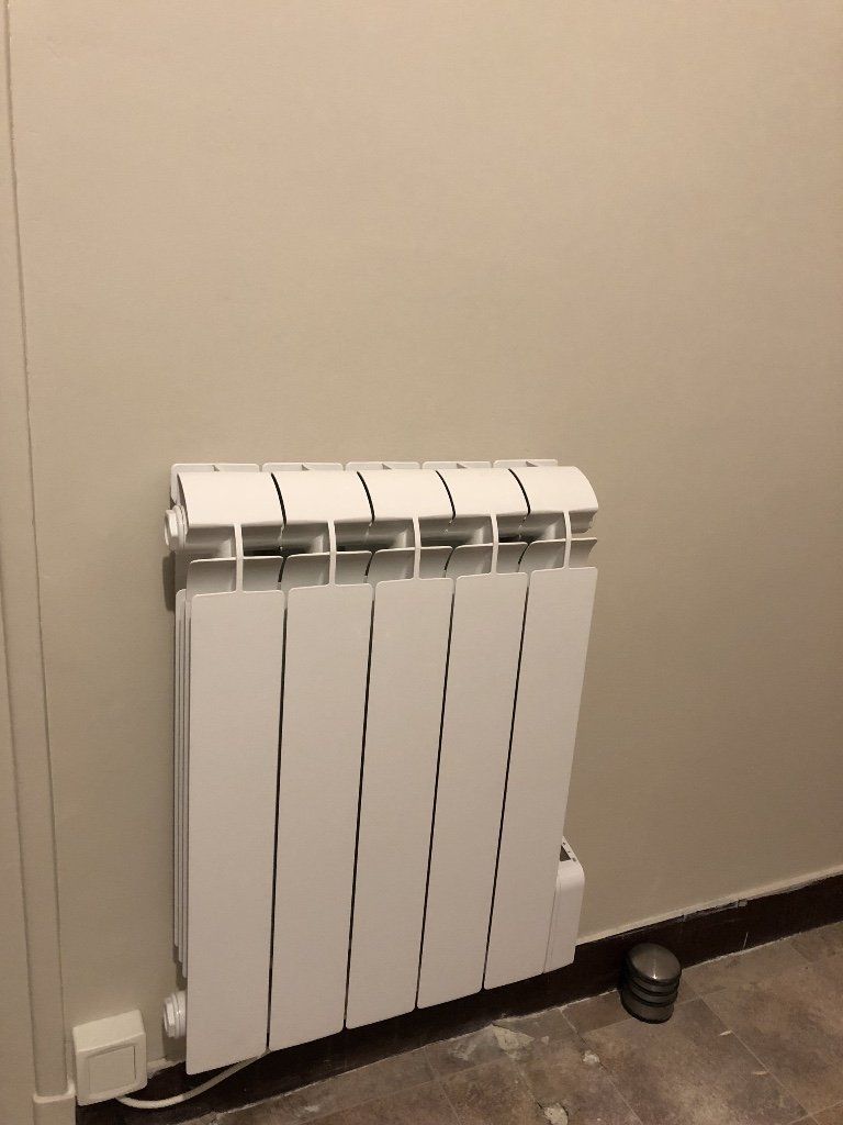 APRES Remplacement d'un radiateur fonte par radiateur AVANT