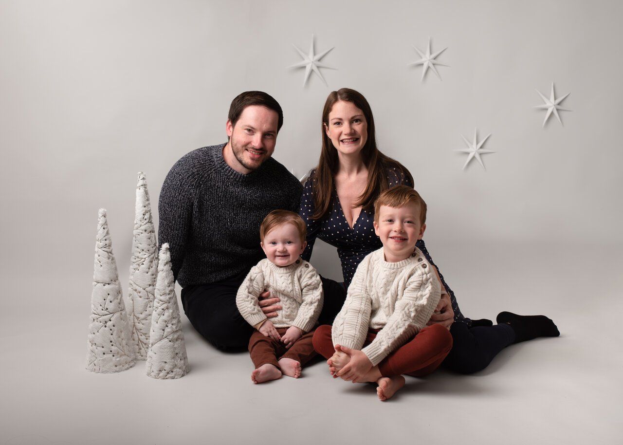 A family photographed during a Christmas family photoshoot with Andrea Thornton Photography
