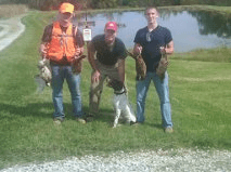 Three Men with their German Shorthaired Pointers and Feasants