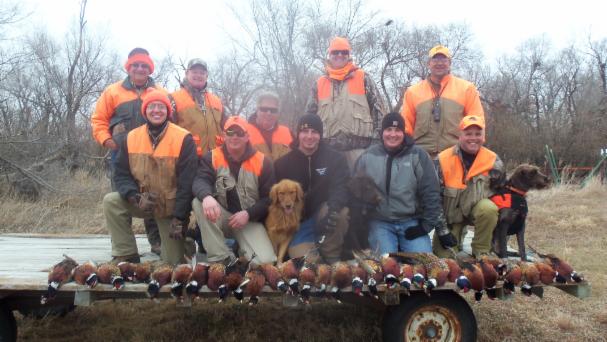 Group of Hunters with their Fowl in South Dakota