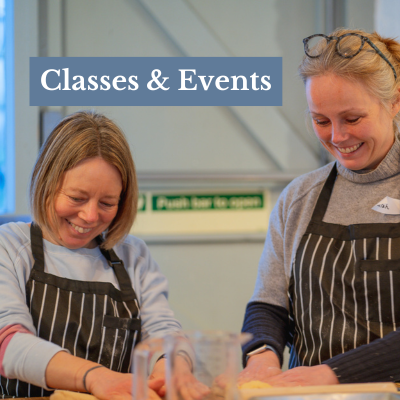 many hands eating paella