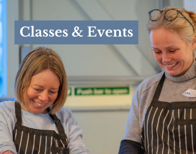 many hands eating paella