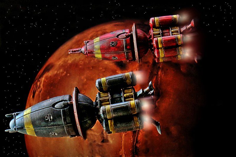 raumschiff bild zwei frachter vor rotem planeten