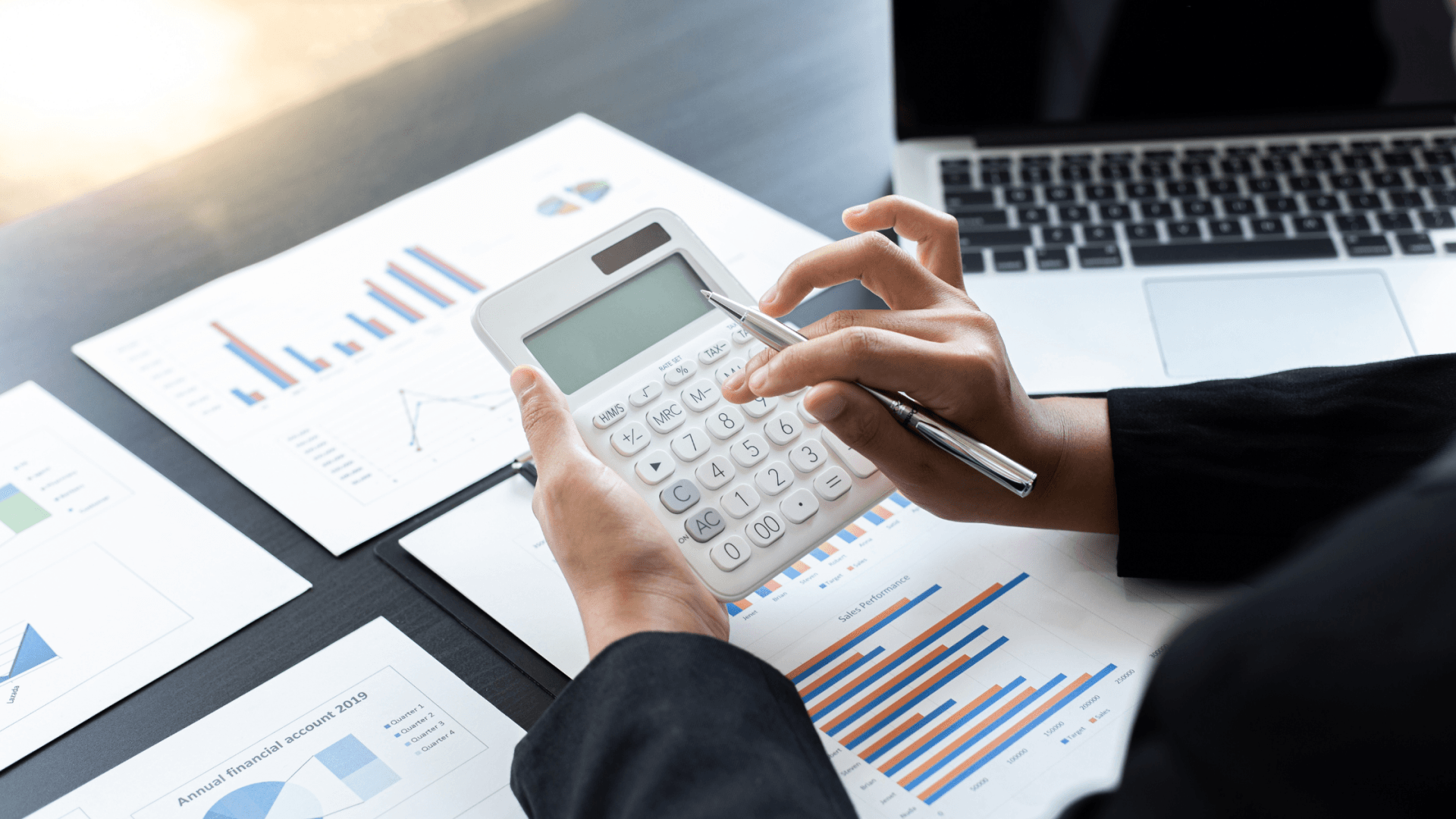 Do you have a budget plan? Person with calculator working out a budget