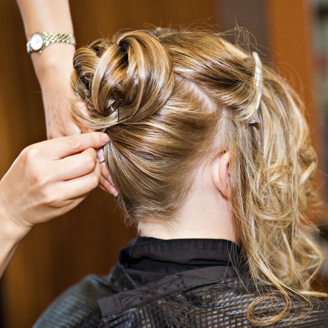 Hair Dresser Hairdressers putting up someone's hair