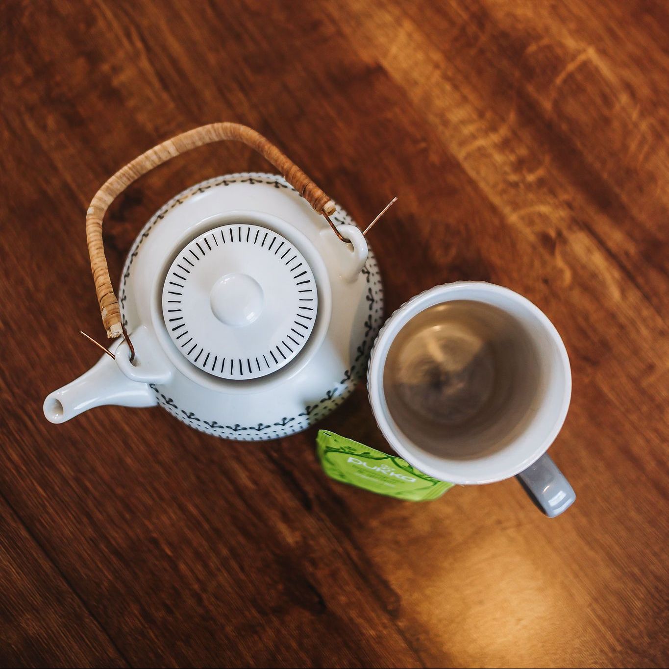 tea pot and cup with herbal tea bag