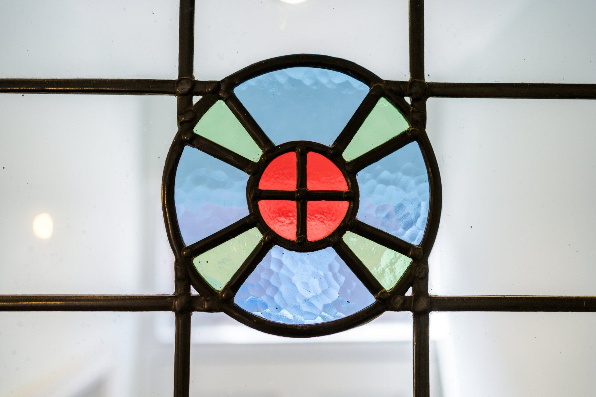 blue green and red stain glass feature