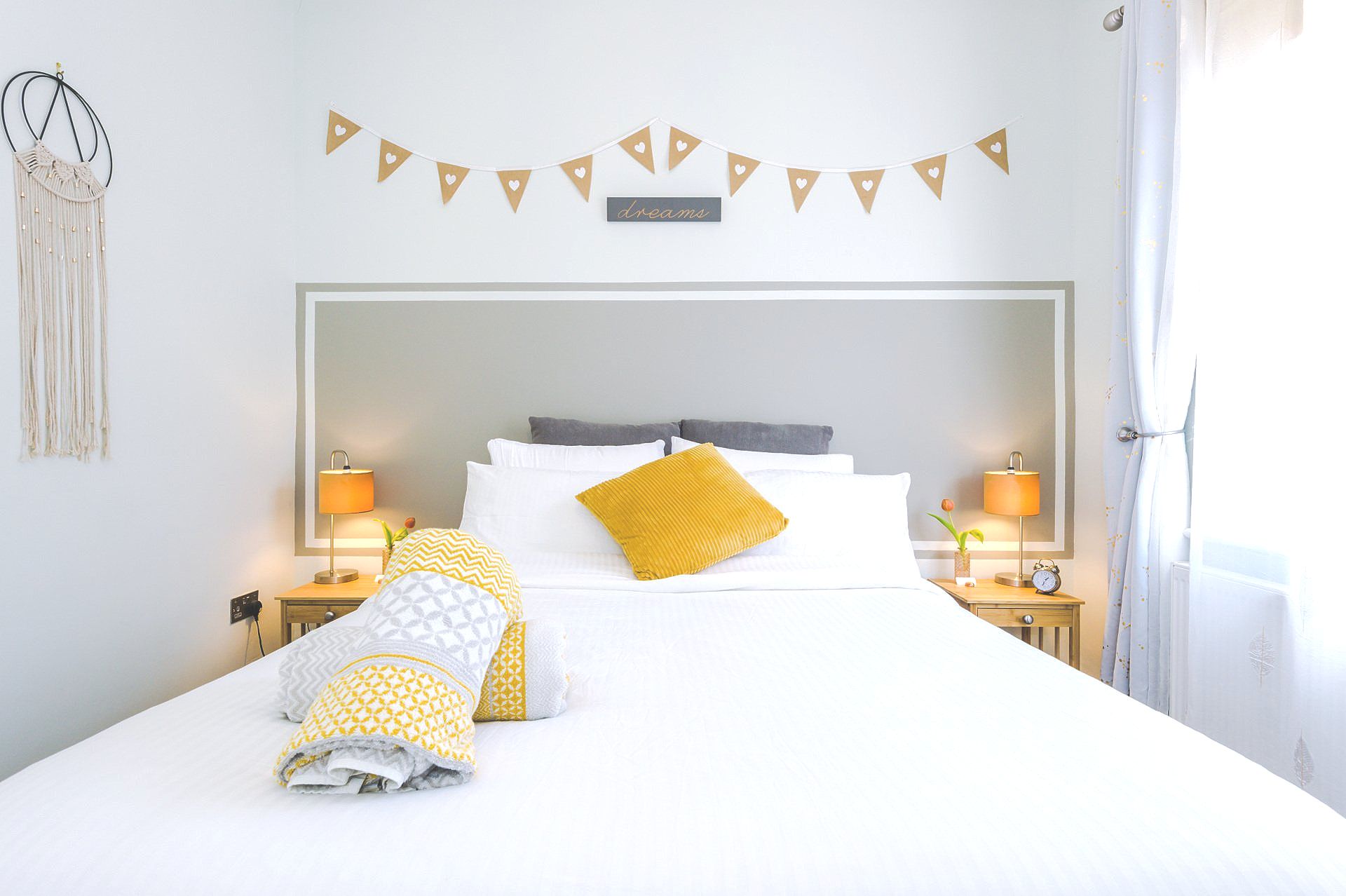 main king bed with yellow towels