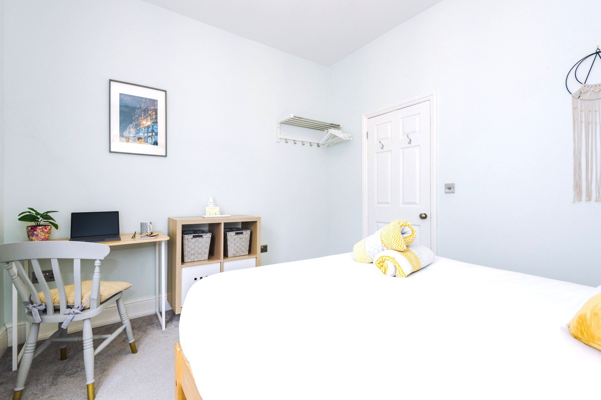 main bedroom storage and clothes rail