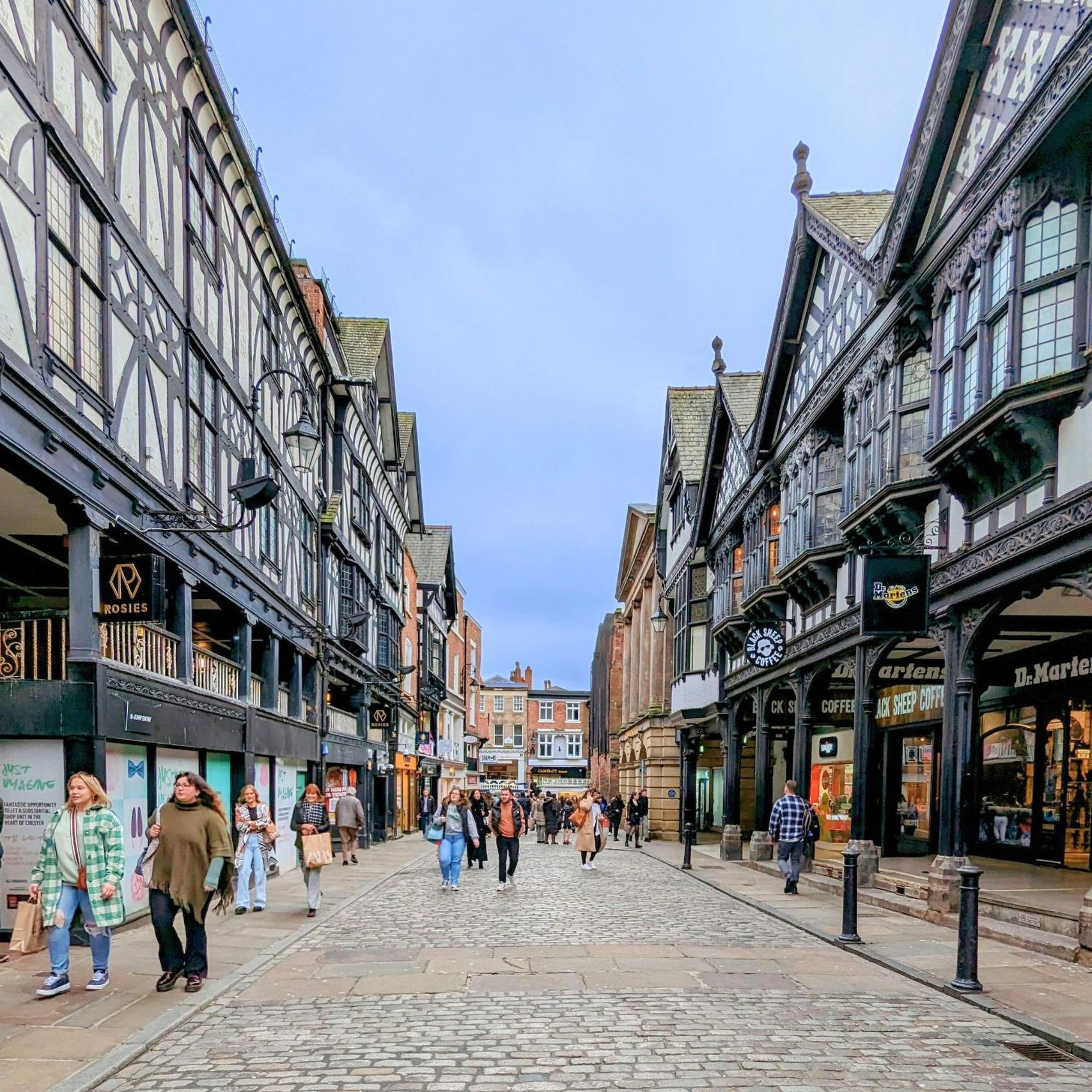 spring cobbled streets full of shoppers