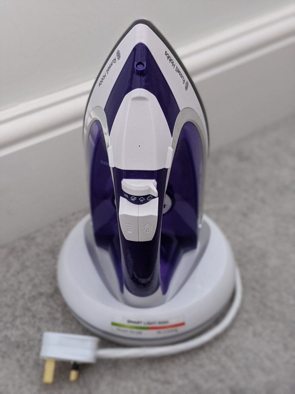 wireless iron in its charging holder