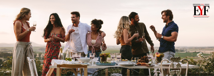 Millennials enjoy an afternoon lunch discussing achieving financial freedom.