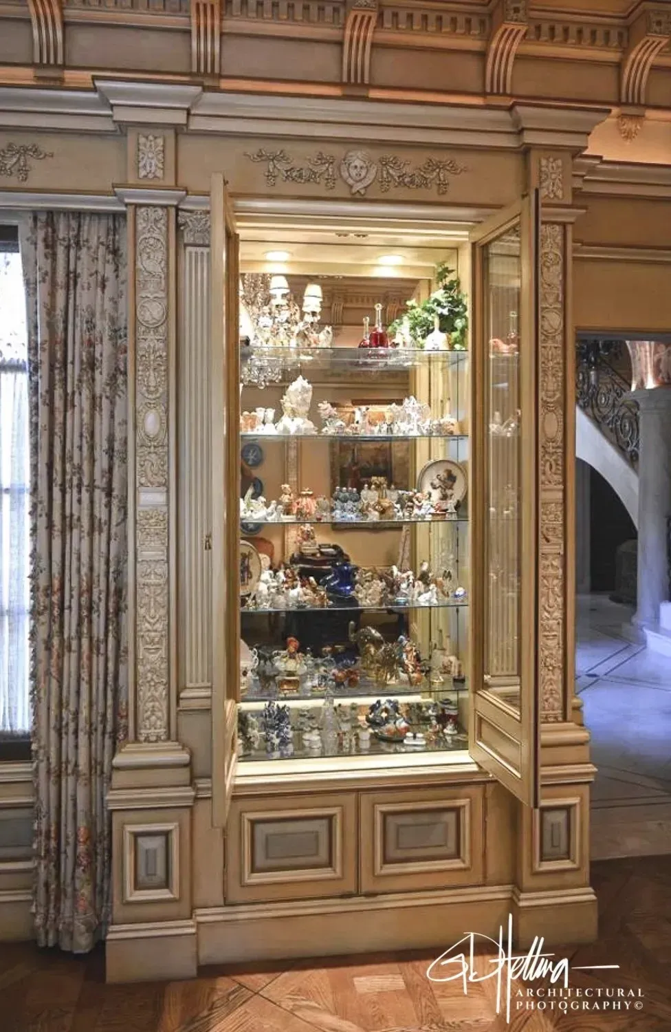Curio cabinet view featuring custom woodwork and glass display detailing at Montecito, California