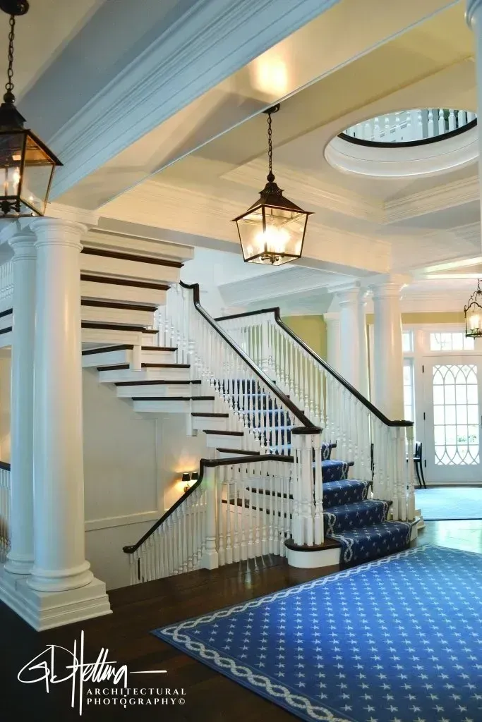 Grand staircase interior featuring elegant residential architectural design and double-height spatial layout – Pier-887