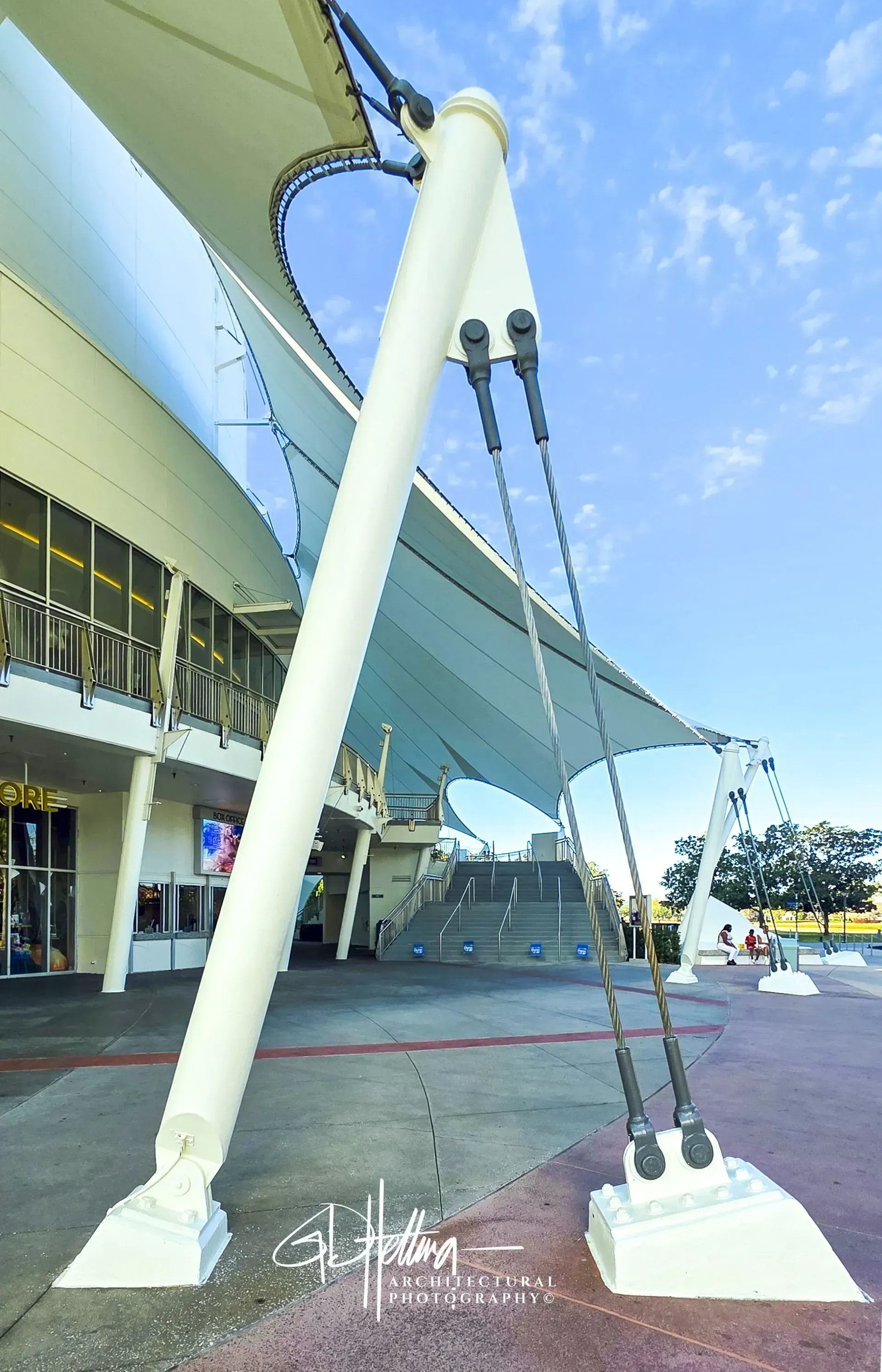 Fabric roof hold down system with tension structure and architectural fabric roofing at Disney Springs FL