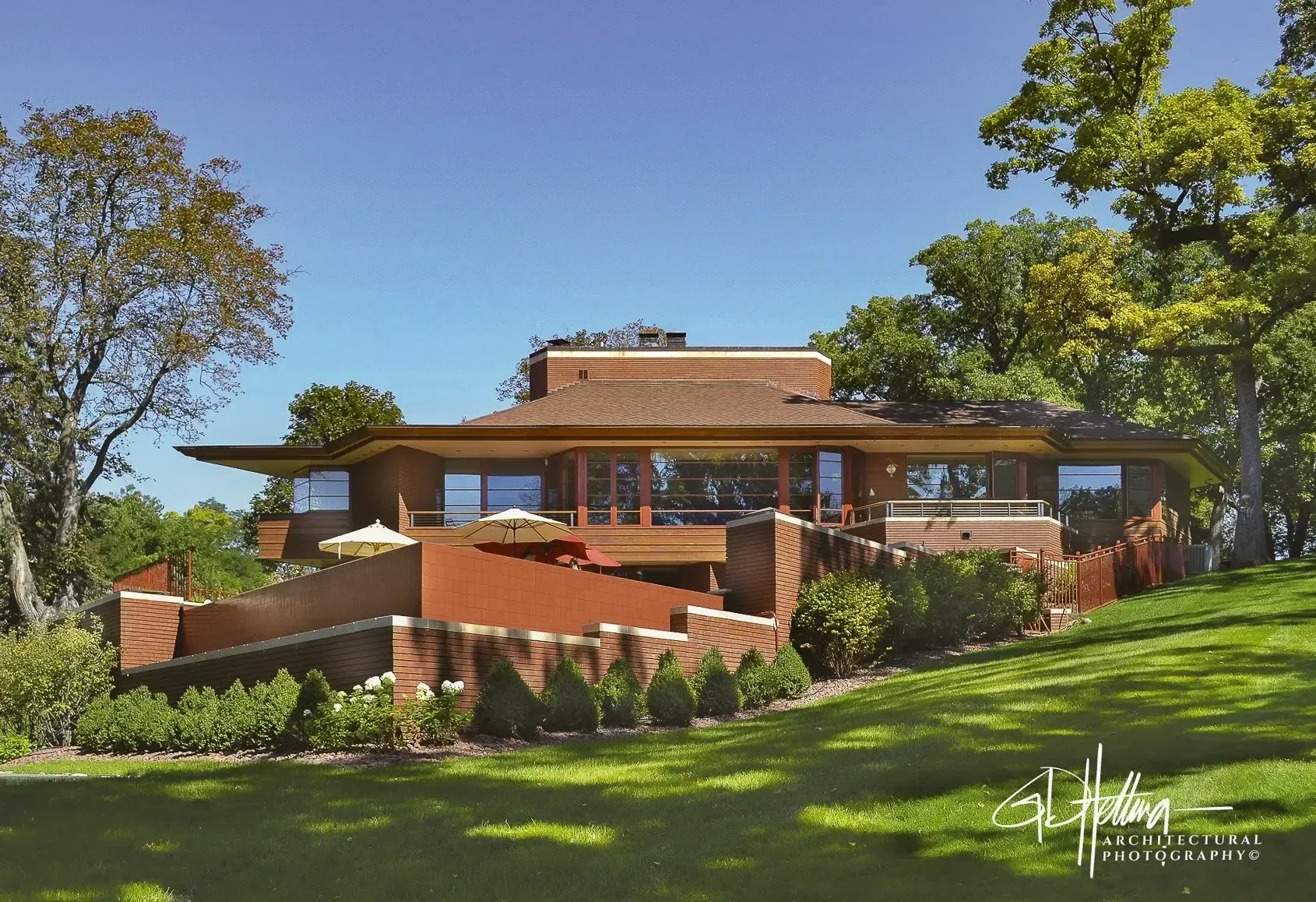 Wrightian Usonian style home exterior featuring mid-century inspired residential architecture – Pier-888