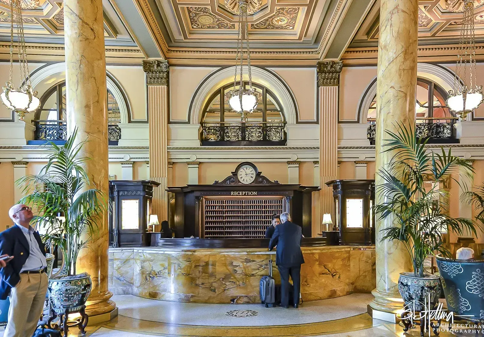 Willard InterContinental reception area, grand interior with columns and chandeliers.