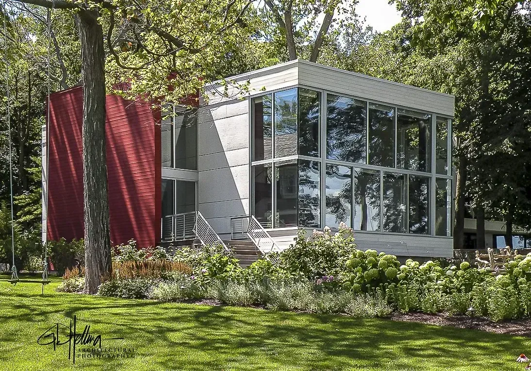 Distinctive home exterior featuring modern architectural design and lakeside residential setting – Archimage Architects Pier-887