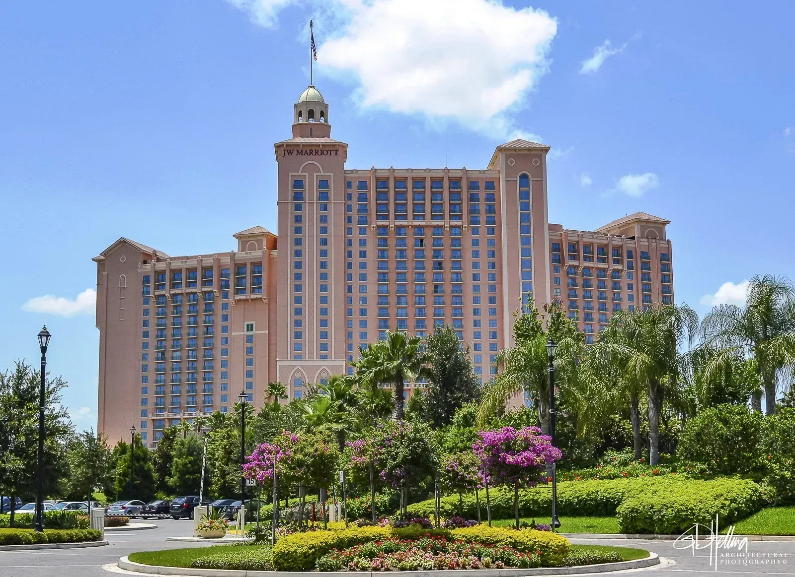 JW Marriott Orlando exterior, modern high-rise resort hotel with palm-lined surroundings.