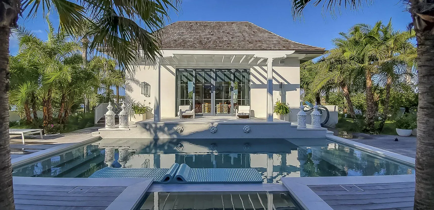 Moroccan-style pool house exterior with detailed design elements and luxury outdoor living environment – Ponte Vedra Beach, FL