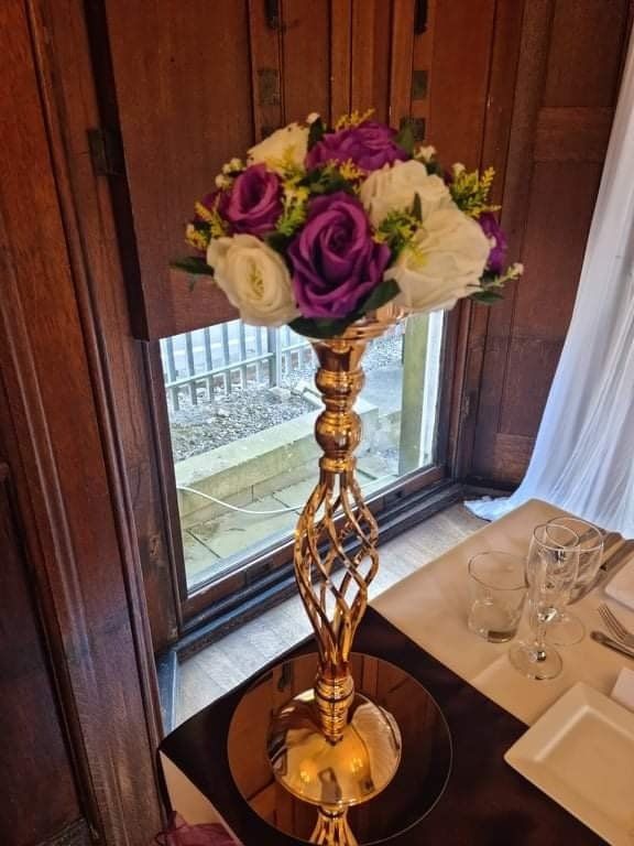 event décor setup with centrepieces and lighting