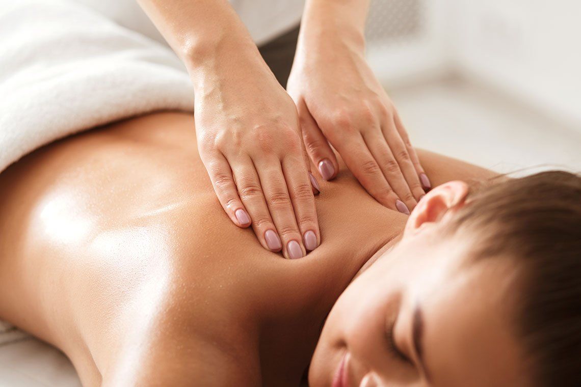 Woman Having a Back Massage — Media, PA — Serenity Wellness Center