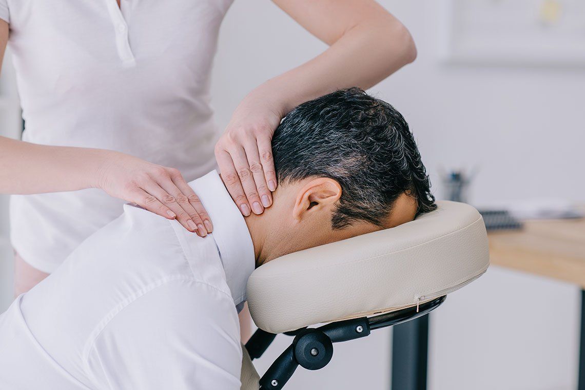 Masseuse Doing Neck Massage — Media, PA — Serenity Wellness Center