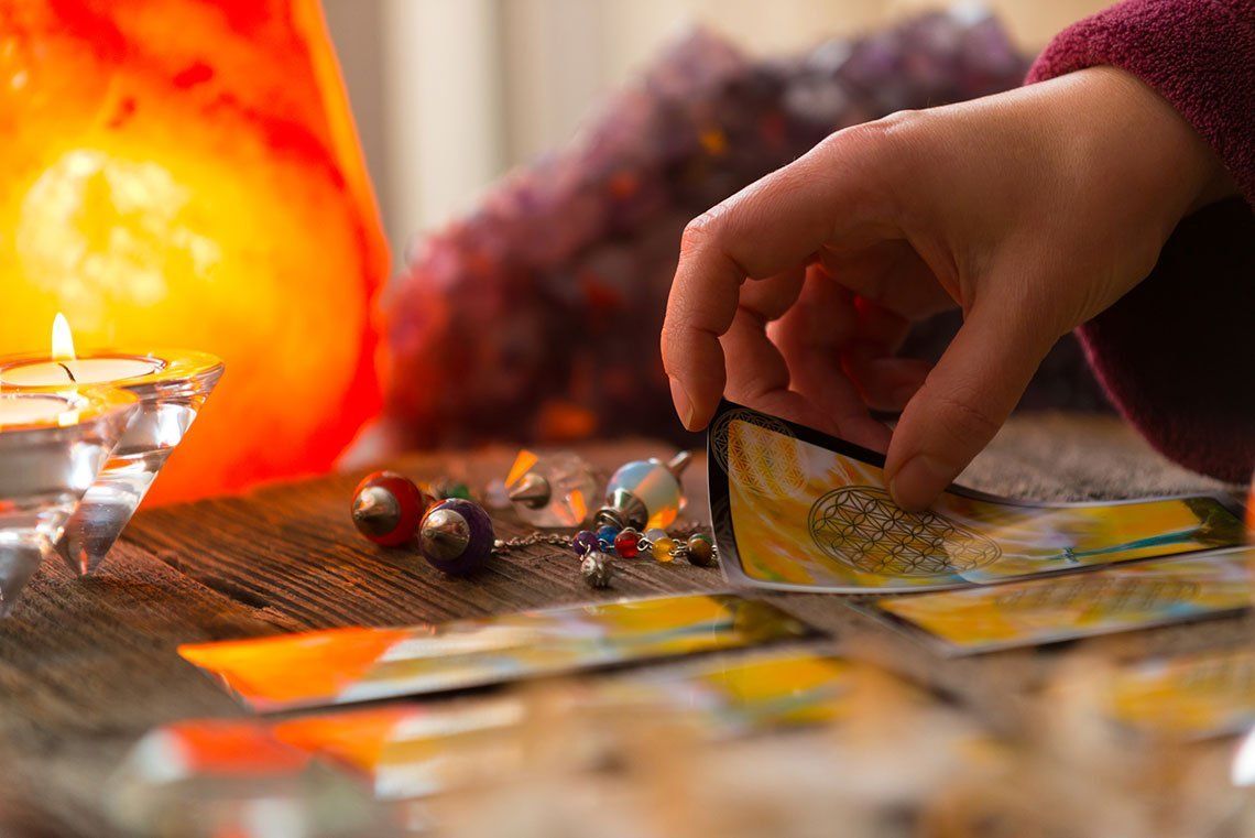 Hand Holding a Tarot Card — Media, PA — Serenity Wellness Center