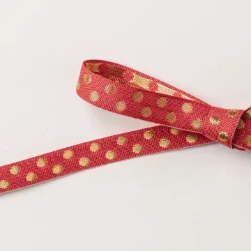 Gepunktetes Geschenkband in Glutrot und Gold Gepunktetes Geschenkband in Glutrot und Gold