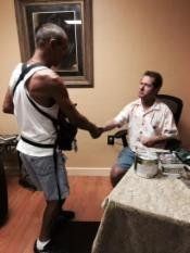 A man shaking Irvin Rosenfeld's hand