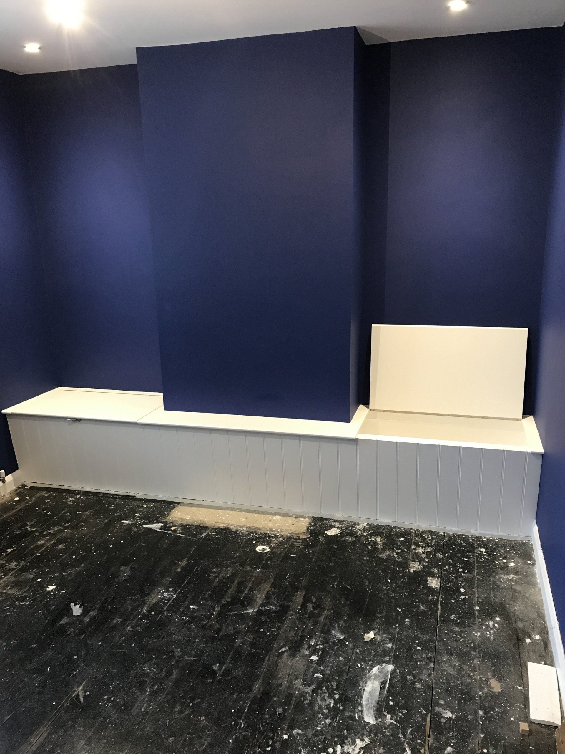Built-in alcove bench seat with integrated storage and groove panelling in Isleworth