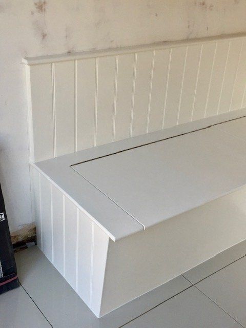 Built-in L-shaped bench seat with lift-up storage in Whitton