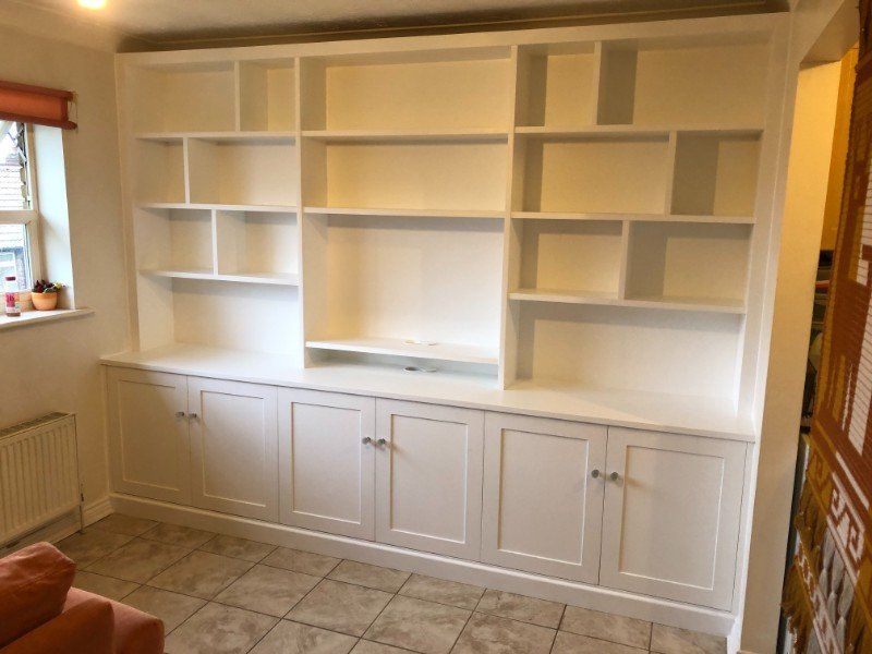 Bespoke TV bookcase unit with display shelving and fitted cupboards in East Sheen