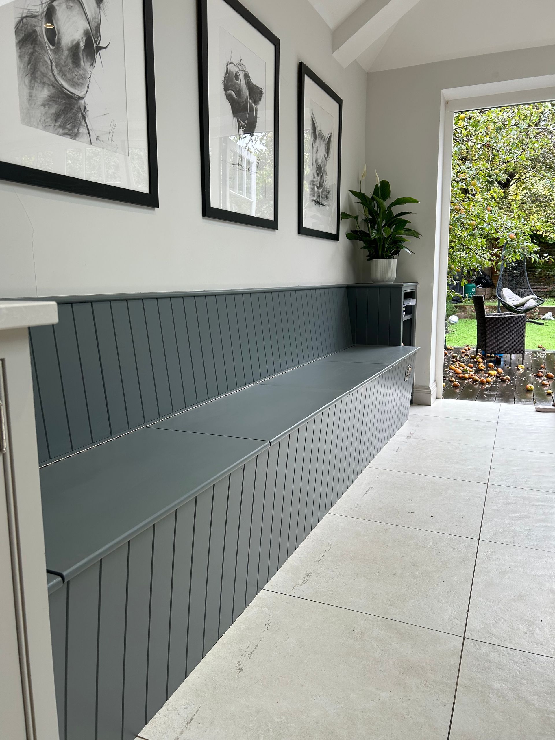 Grey fitted bench seat with shaker panelling and storage in East Sheen