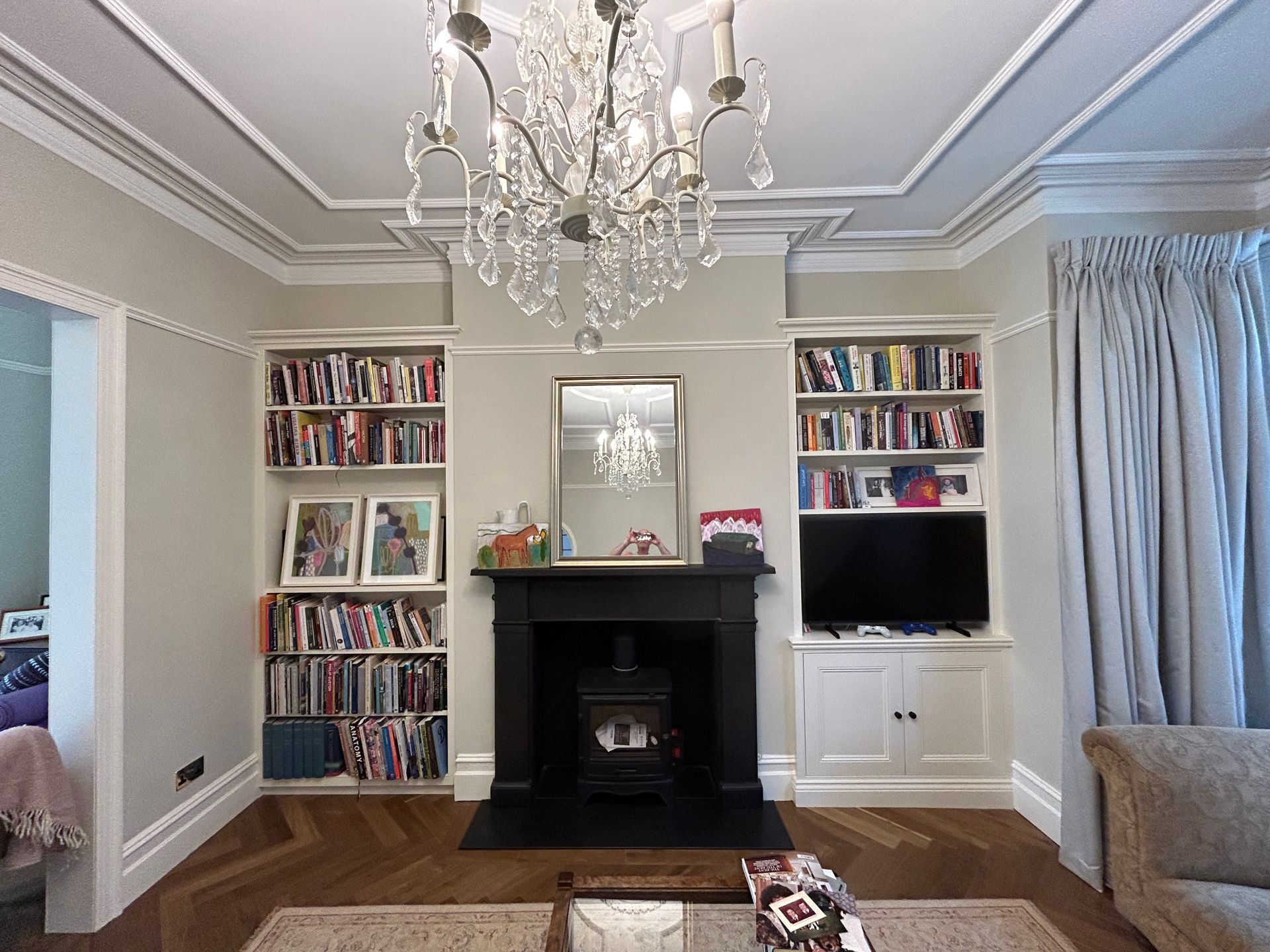 Alcove bookcase and fitted TV unit with soft close door function with shelving in Kew