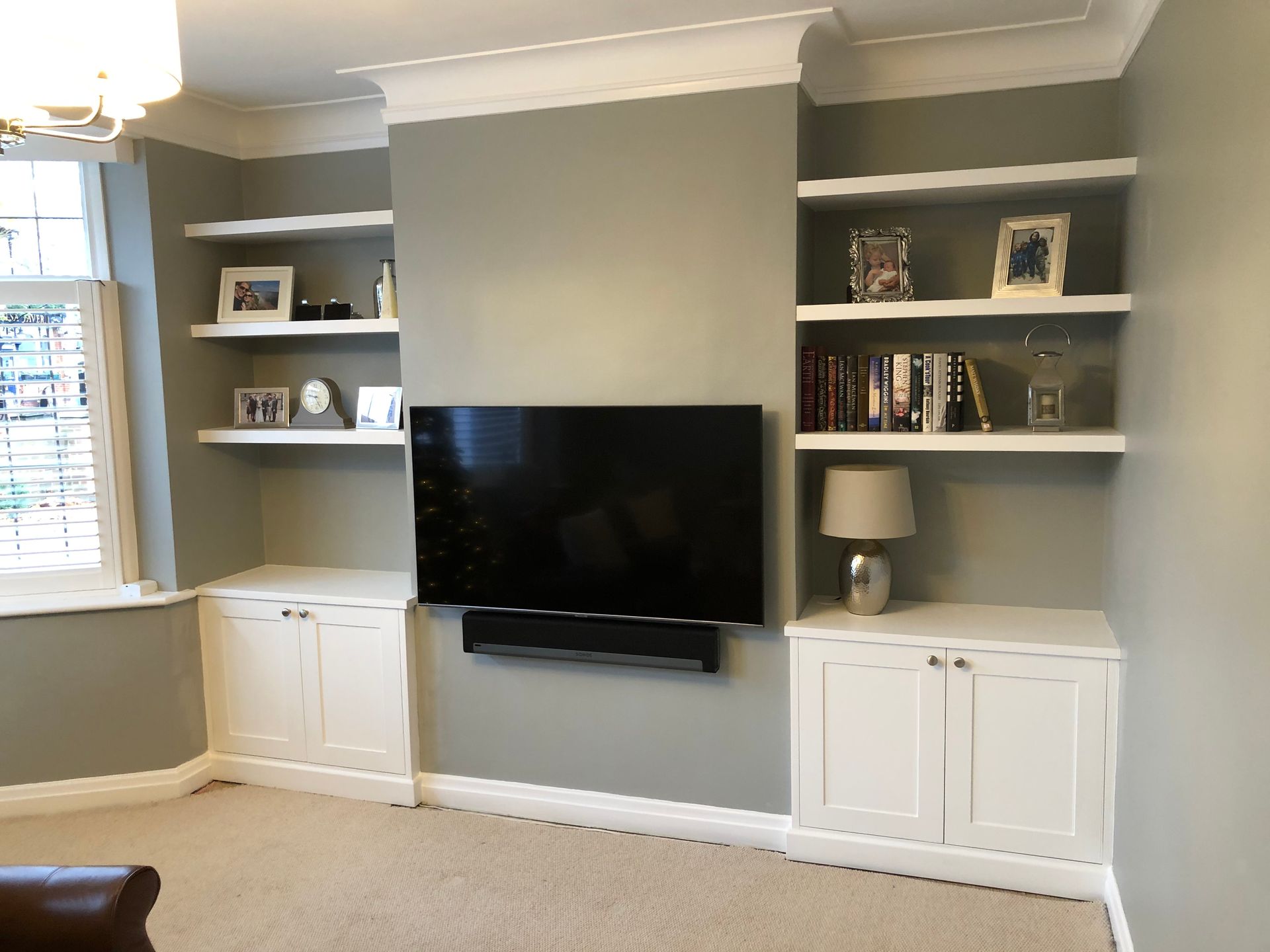 Contemporary shaker alcove cupboards with thick floating shelves fitted in chimney breast alcoves in Teddington