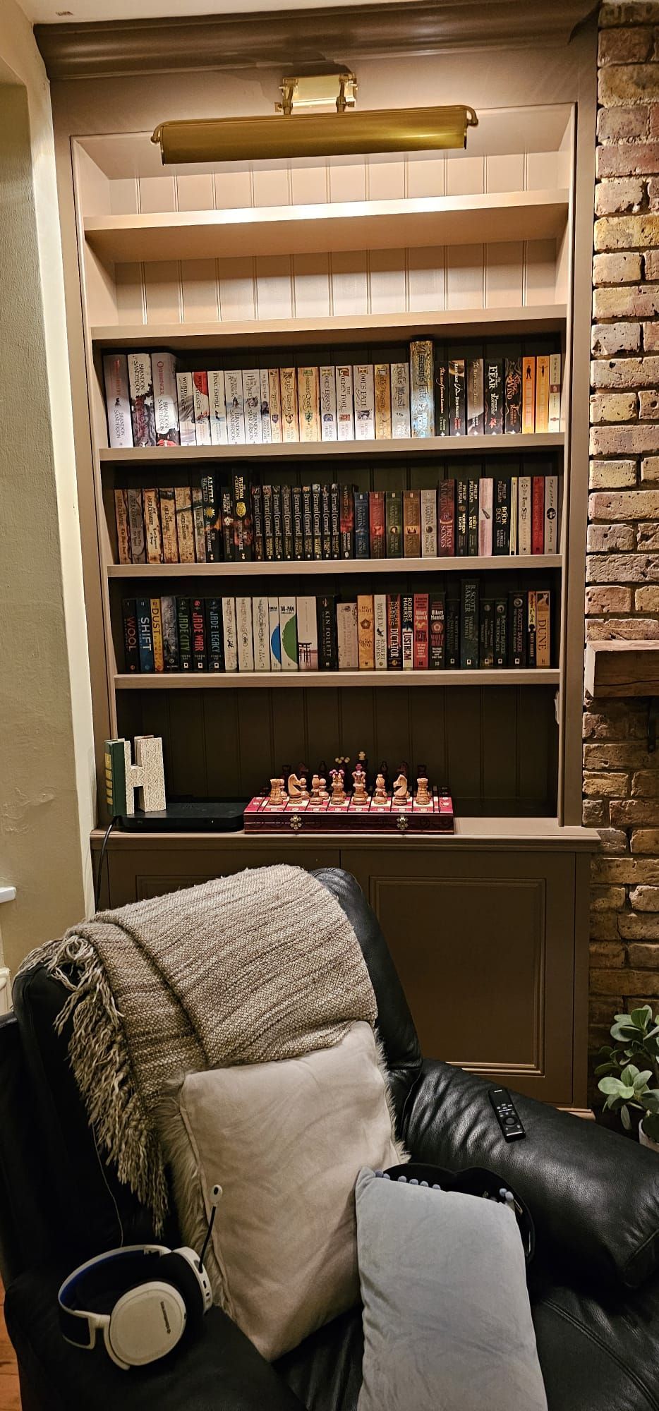Alcove bookshelves with grooved and beaded backing panels and library lighting in Richmond