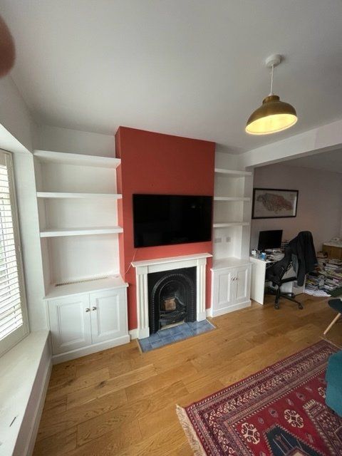 Alcove cupboards with floating shelves in chimney breast alcoves in North Sheen