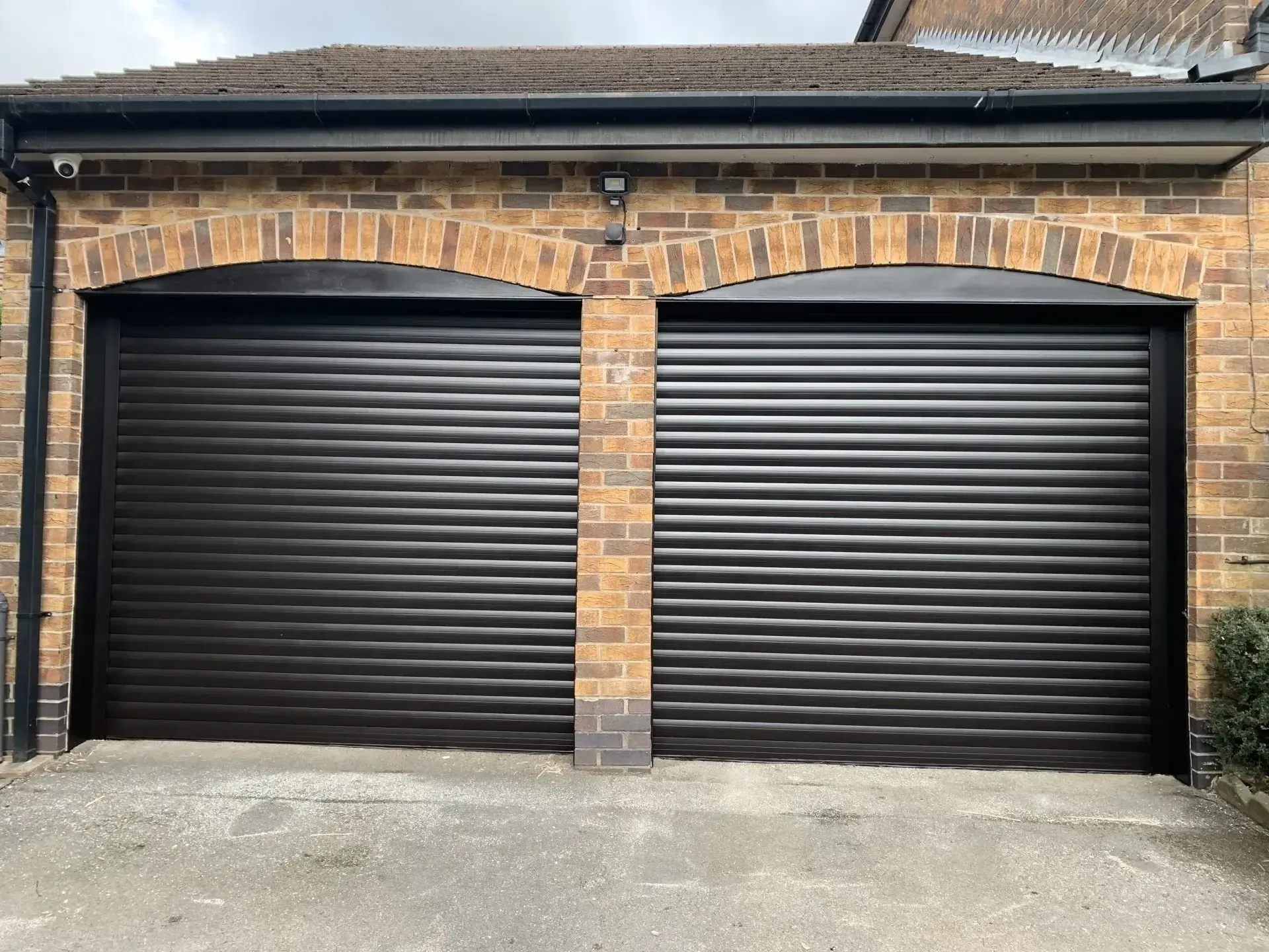 Garage doors spray painted black
