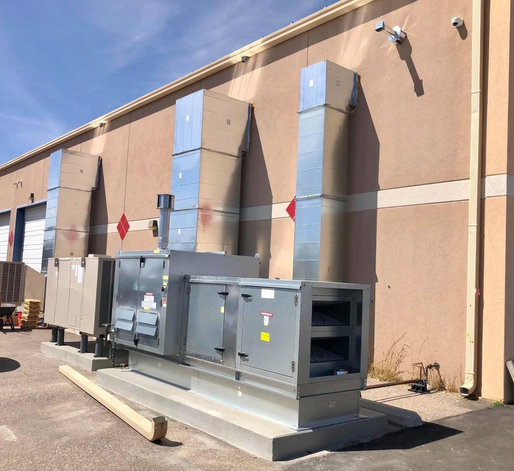 man completing HVAC repairs