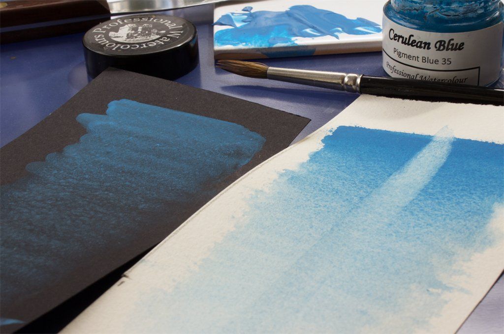 Washes of Cerulean Blue on white and black paper. Washes of A J Ludlow Cerulean Blue Professional Watercolour on white and black paper.