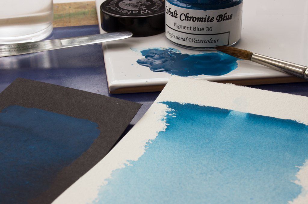Washes of A J Ludlow Cobalt Chromite Blue Professional Watercolour on white and black paper.