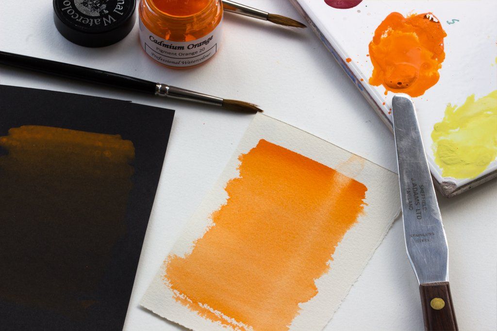 Graduated washes of Cadmium Orange on black and white watercolour paper Cadmium Orange watercolour