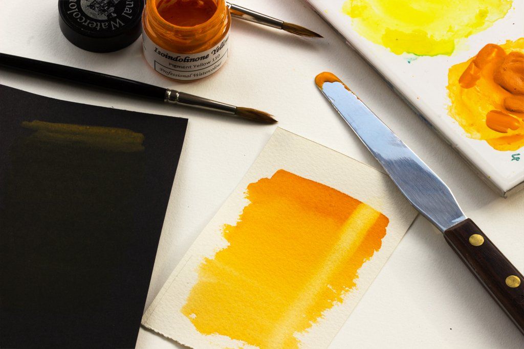 Graduated washes of Isoindolinone Yellow on black and white watercolour paper Isoindolinone Yellow watercolour