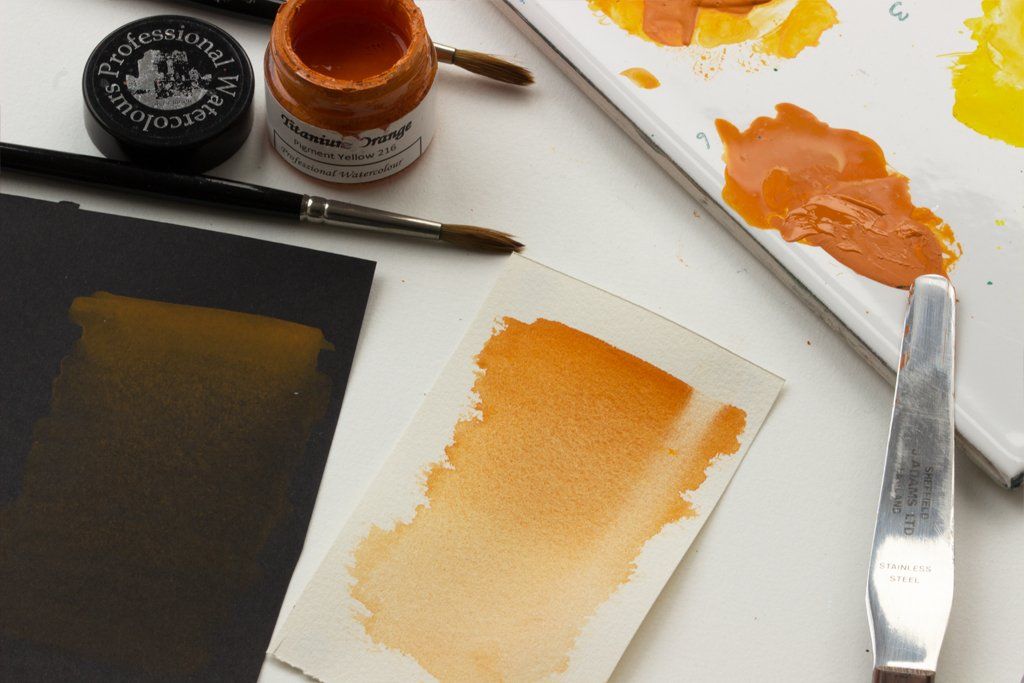 Graduated washes of Titanium Orange on black and white watercolour paper Titanium Orange watercolour