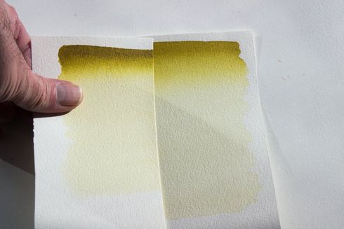 It is easier to compare samples at similar film weights by moving the wash of the test sample up and down the one its being compared too. Comparing a graduated wash of A J Ludlow's Azomethine Green watercolour against its standard.