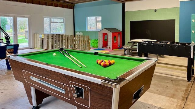 Large games room, with under 5's area. Play house, toy kitchen, black board, table tennis, air hockey, pool, table football