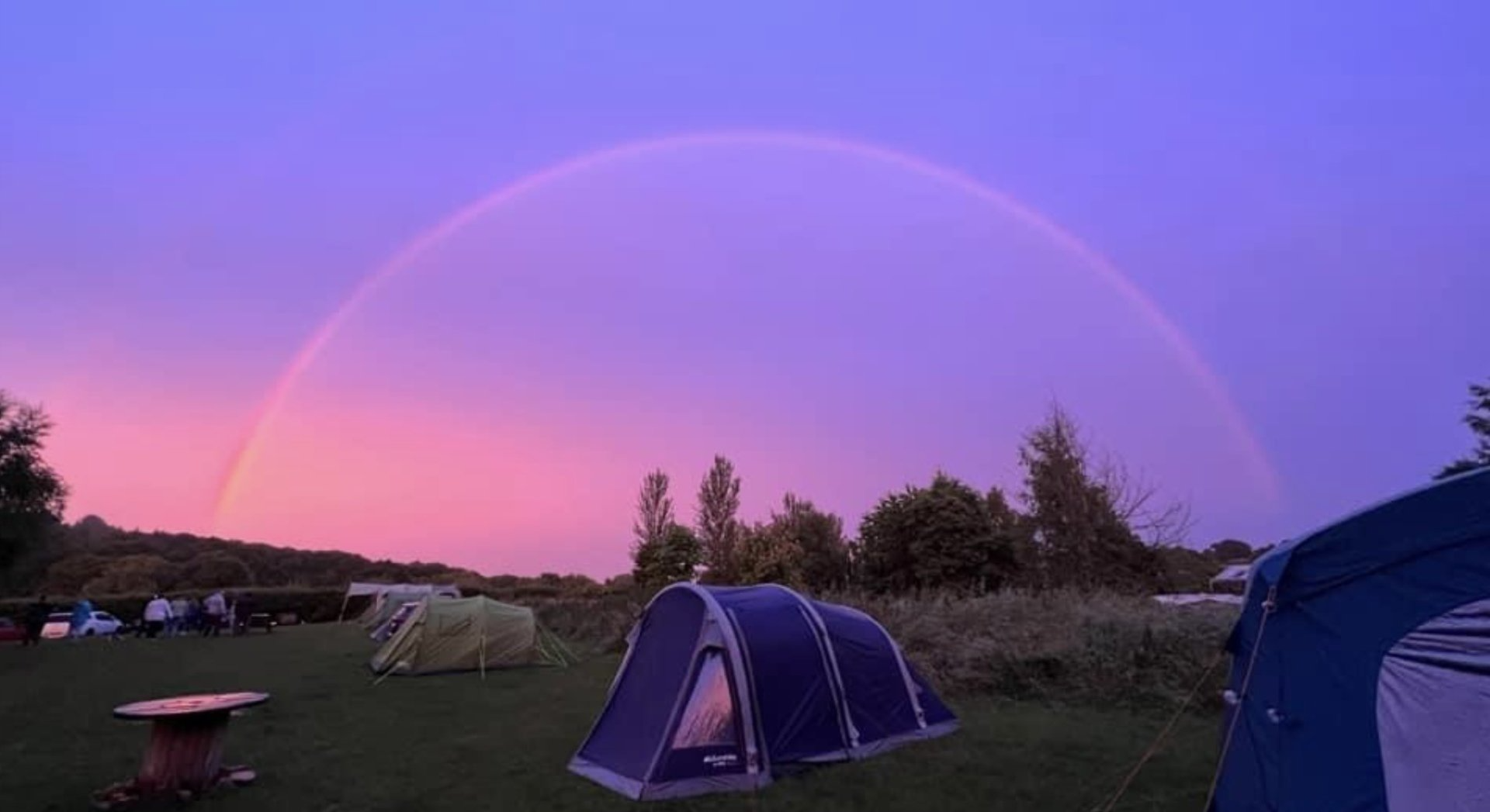 Rainbow love from one of our guests over the tents on a summers evening